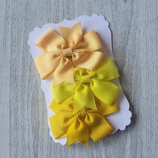 Yellow shades grosgrain pinwheel hair bow clips